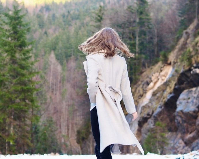Woman in coat standing in forest 🌳 Nature Fashion Photography ✨